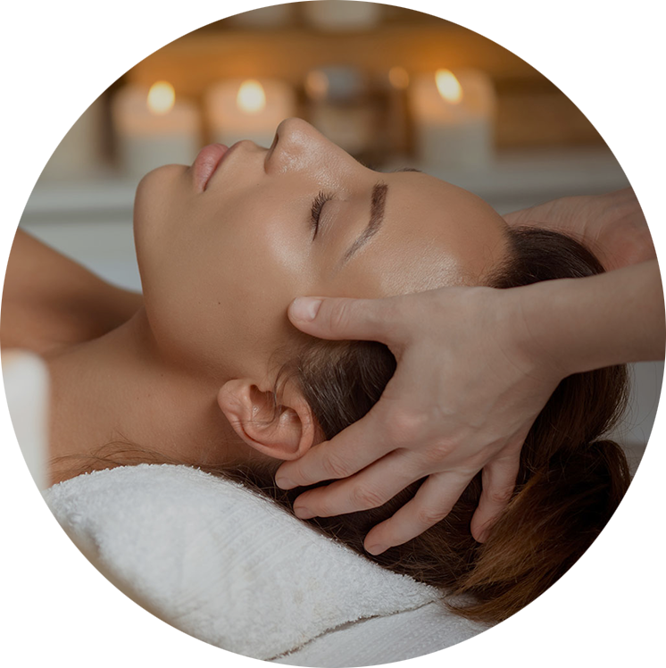 A woman receives a head massage