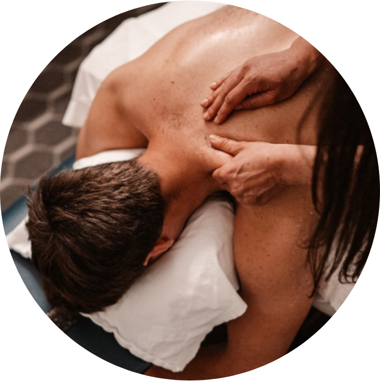 Massage being performed on a patient's upper back