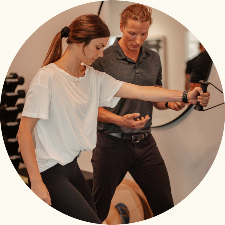 Dr. Schulz guiding a kinesiology patient through an exercise