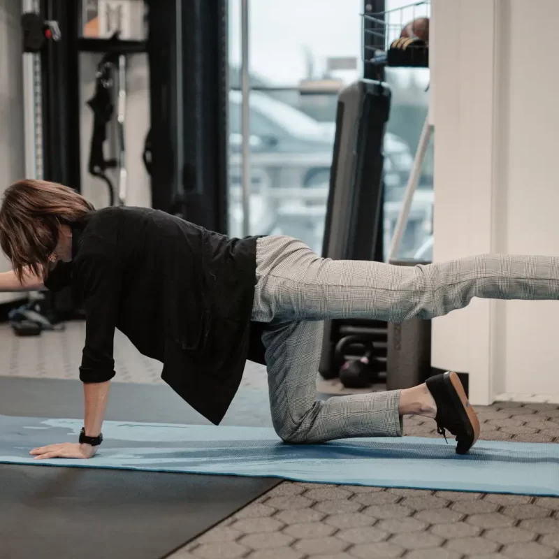 Physiotherapist.demonstrating.straight.leg_.raise